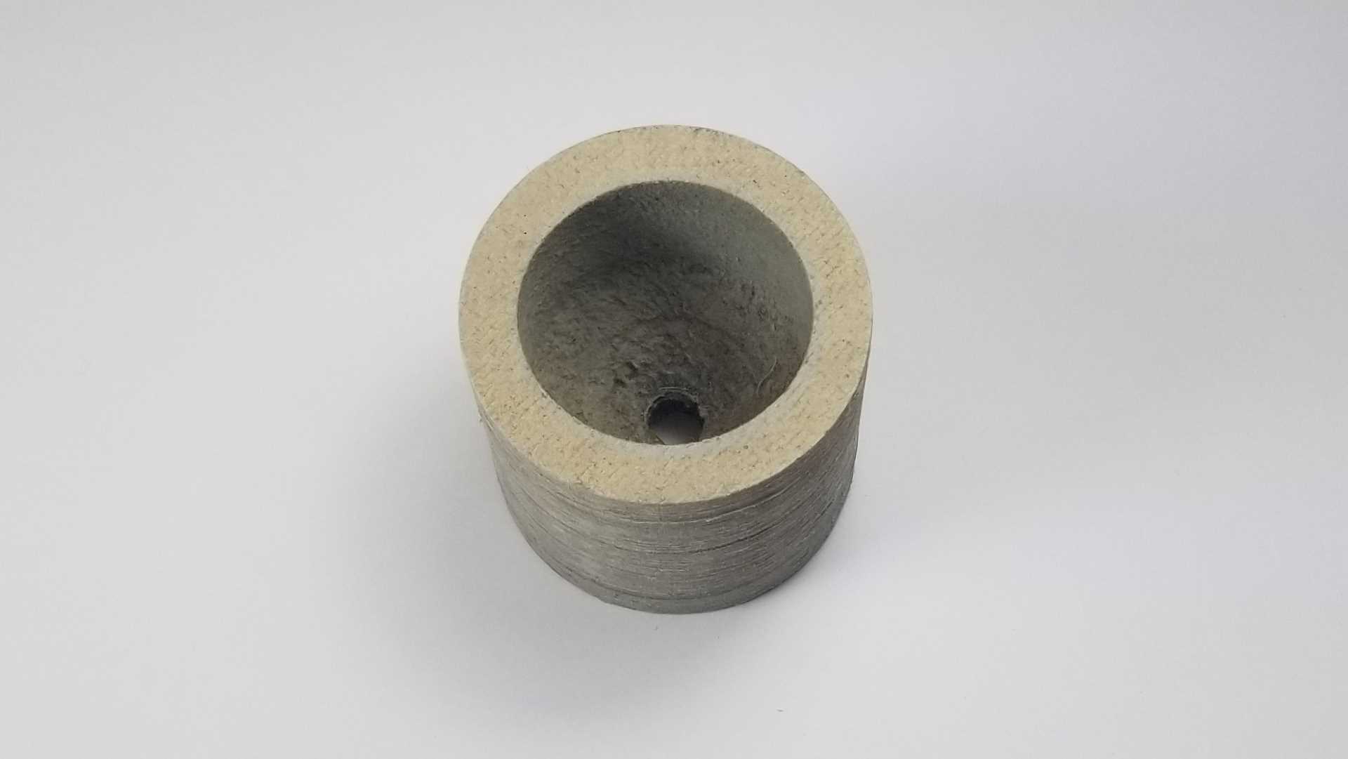 9349642 Missile Nose Support. This medium density fiber board part includes 3 operations. Die cutting, milling, and gluing.